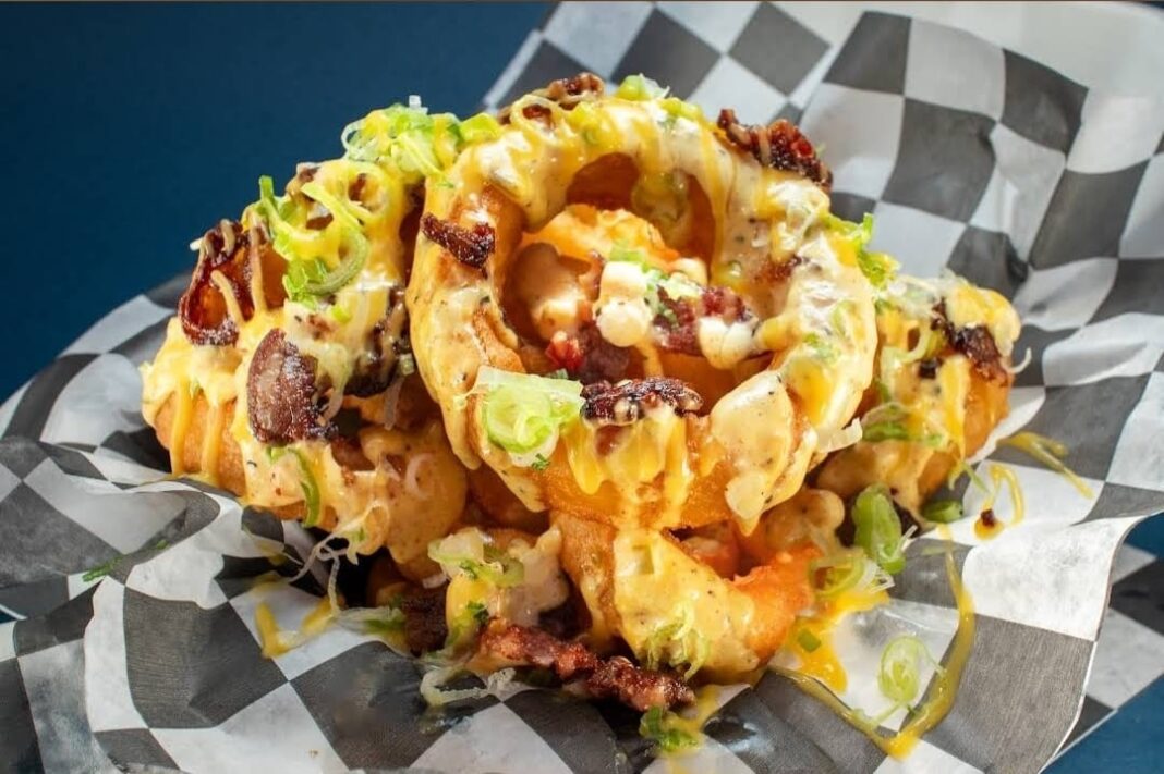 Loaded Onion Rings with Cheese and Bacon at Supreme Burger Company